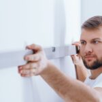 worker checking the wall panffwc 1